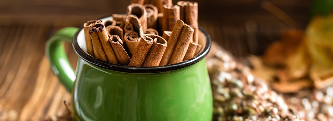 A mug of cinnamon sticks